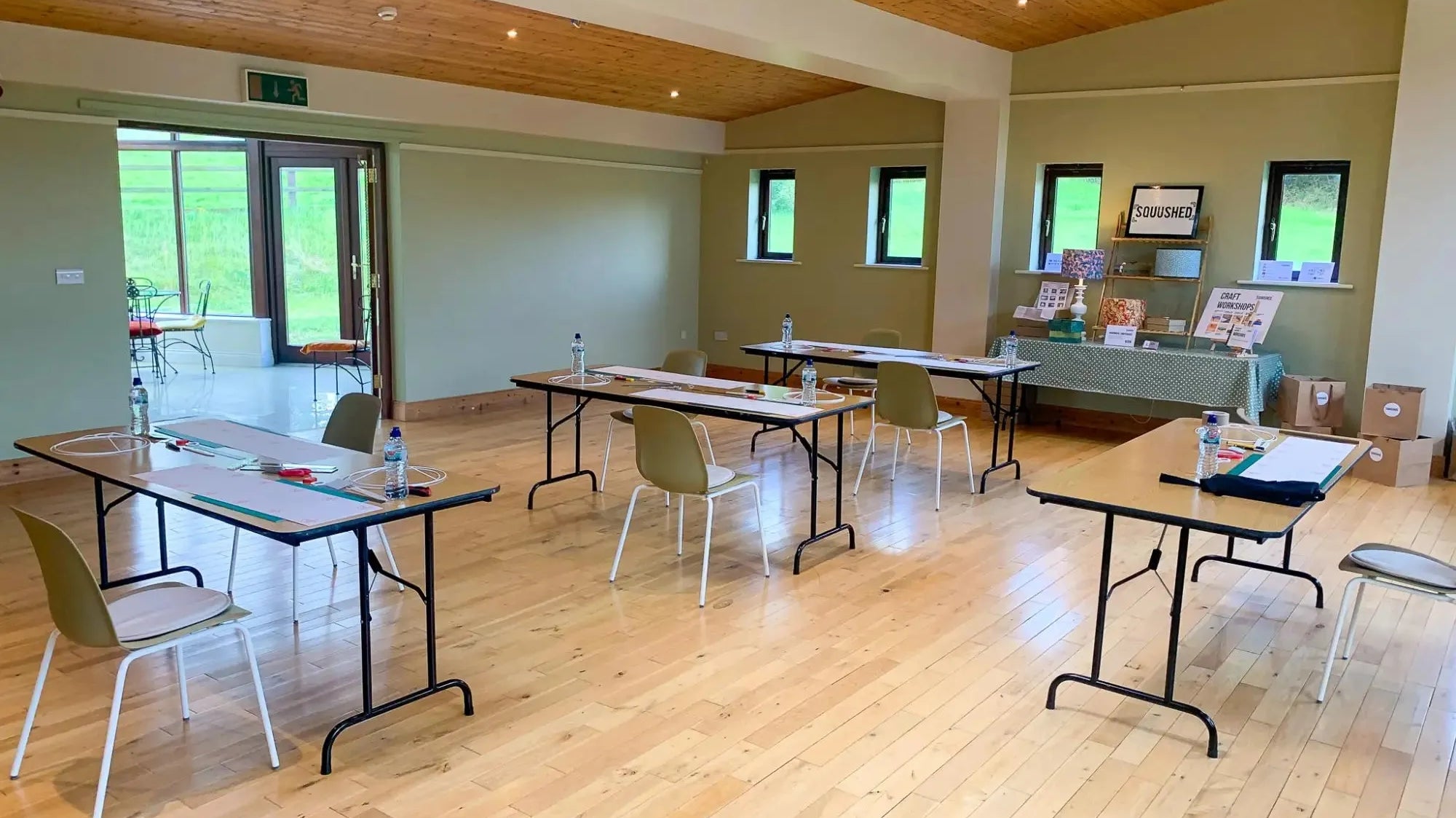 tables chairs and materials set up for a lampshade workshop