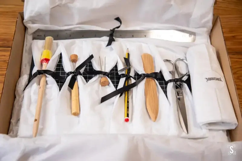 Culinary tool kit with various utensils for efficient bookbinding tools organization