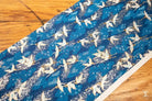 Fabric featuring a blue background with a white bird pattern, ideal for Japanese Chiyogami prints