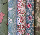 Collection of Japanese Chiyogami fabric rolls showcasing hand designed floral and geometric prints