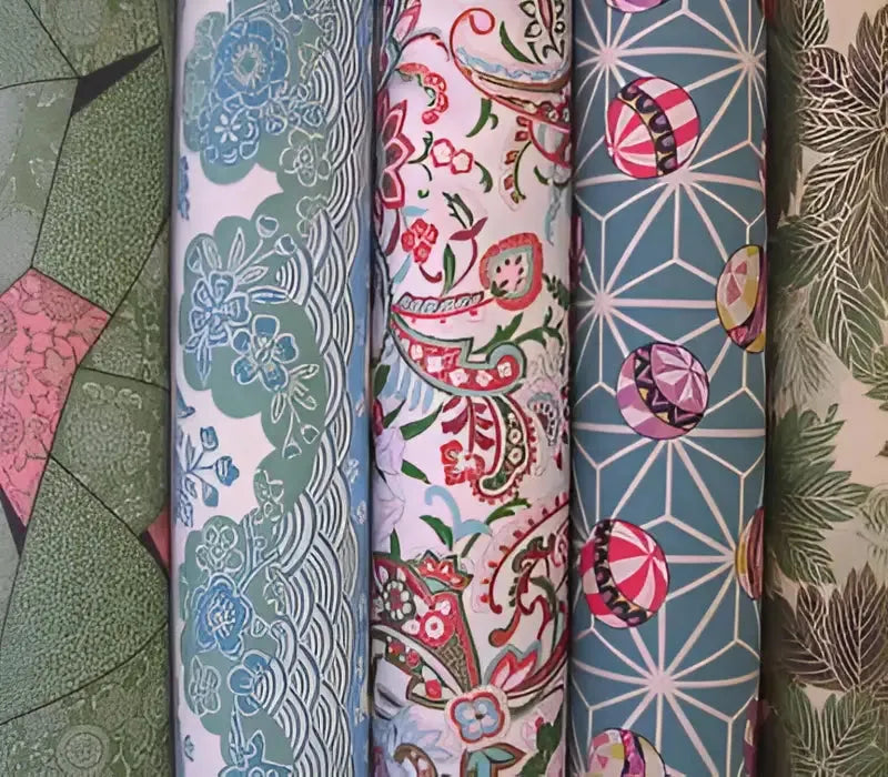 Collection of Japanese Chiyogami fabric rolls showcasing hand designed floral and geometric prints