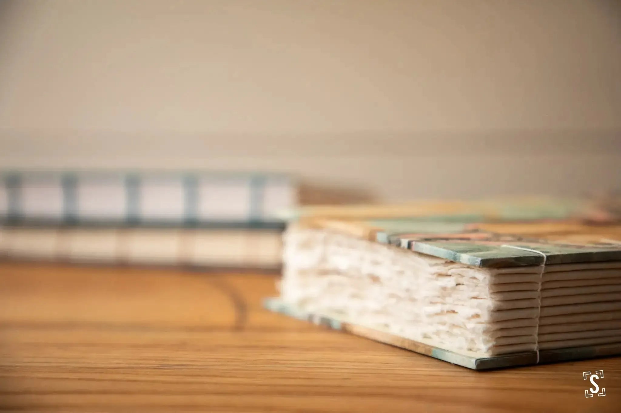 A coptic stitch book with handmade paper