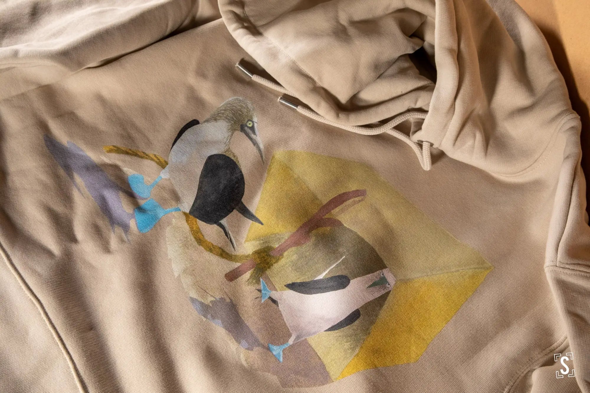 T-shirt with a bird design printed on it.