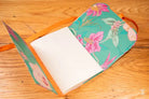 Floral-patterned fabric notebook with white pages from Bookbinding Workshop chain stitch design