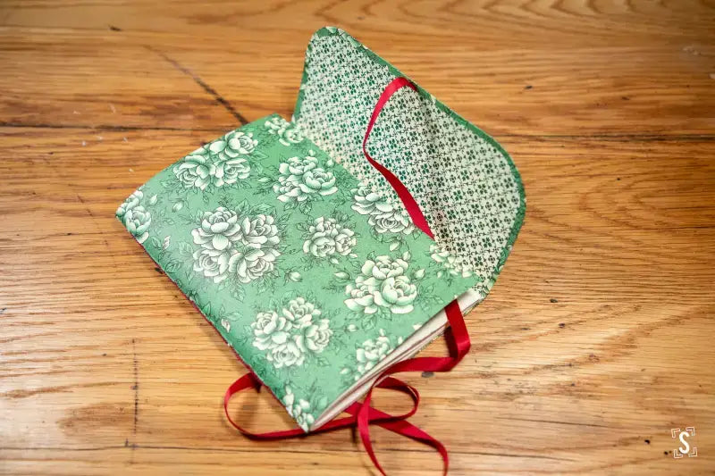 Handmade fabric notebook featuring green floral pattern, ideal for Chain Stitch Workshop