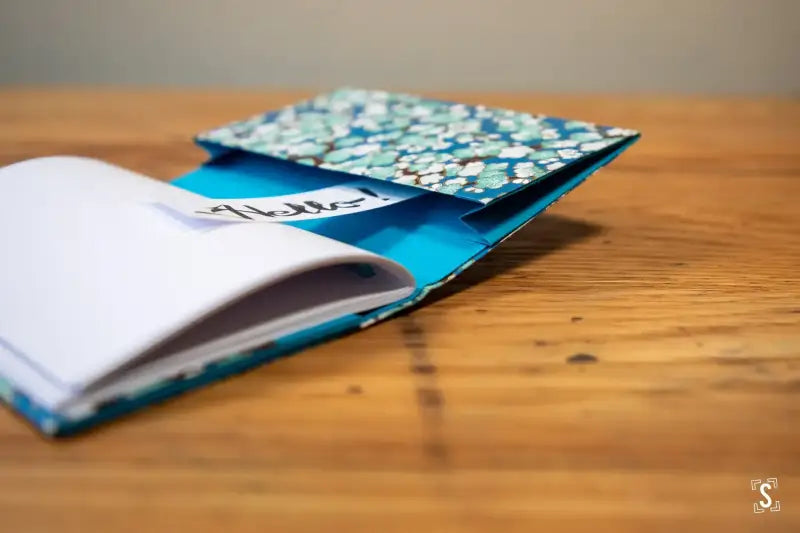 Colorful floral notebook with blue accents from the Bookbinding Workshop on Chain Stitch