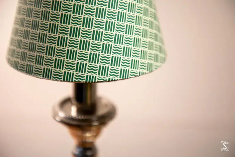 Lamp with a green and white geometric patterned shade for Candle Lampshade Making Workshop