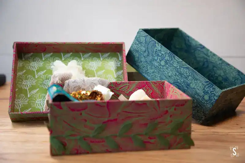 Decorative gift boxes showcasing contents for the Keepsake Box Making Workshop