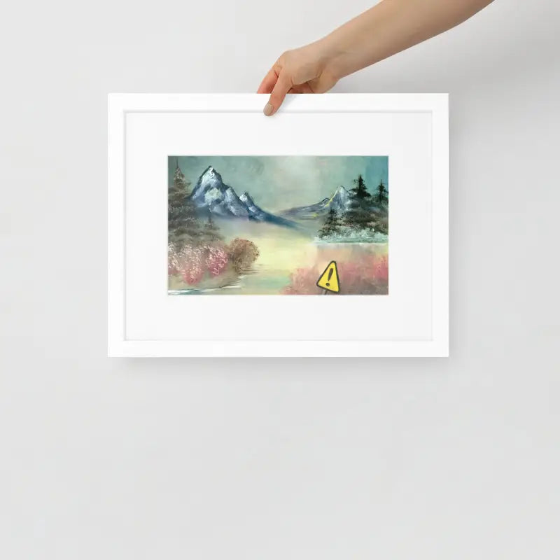 Hand holding a Framed Poster of a mountain landscape on matte paper in vibrant yellow