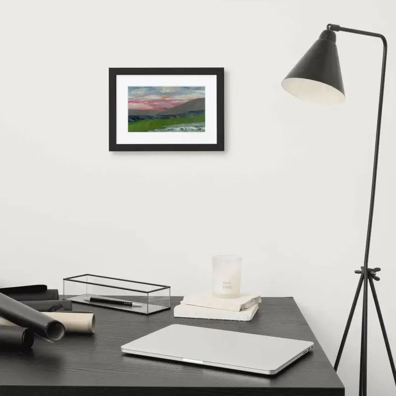 Desk with laptop and lamp featuring Framed Poster of a Pink Sky Landscape