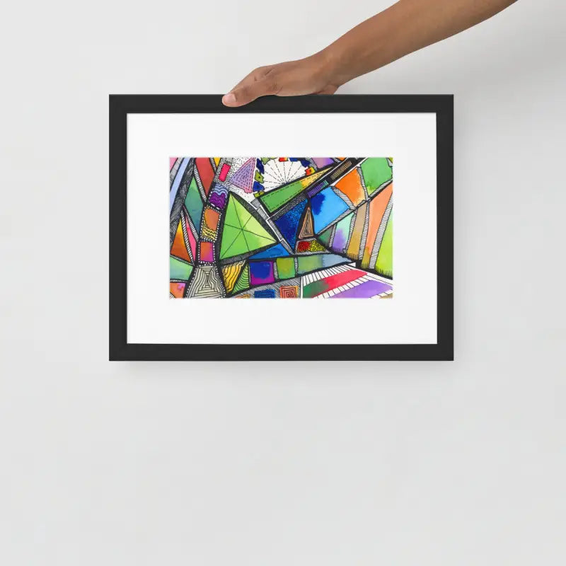 Hand holding a Framed Poster of a colorful abstract painting on matte paper