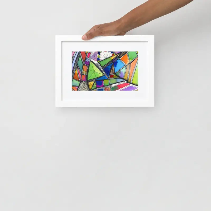 Hand holding a Framed Poster of a colorful abstract painting on matte paper