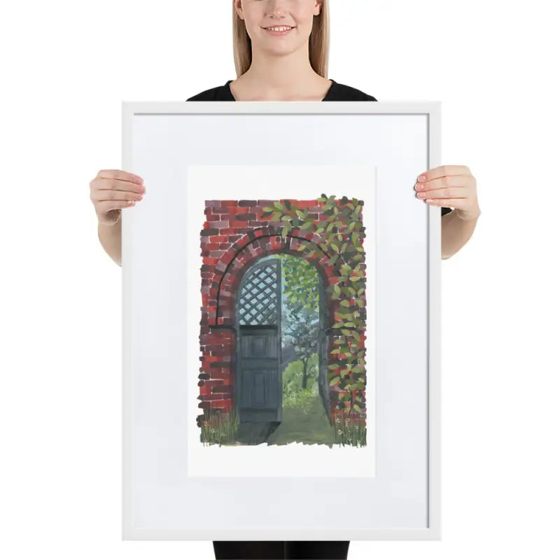 Woman showcasing a Framed Poster of a door in vibrant colours on matte paper