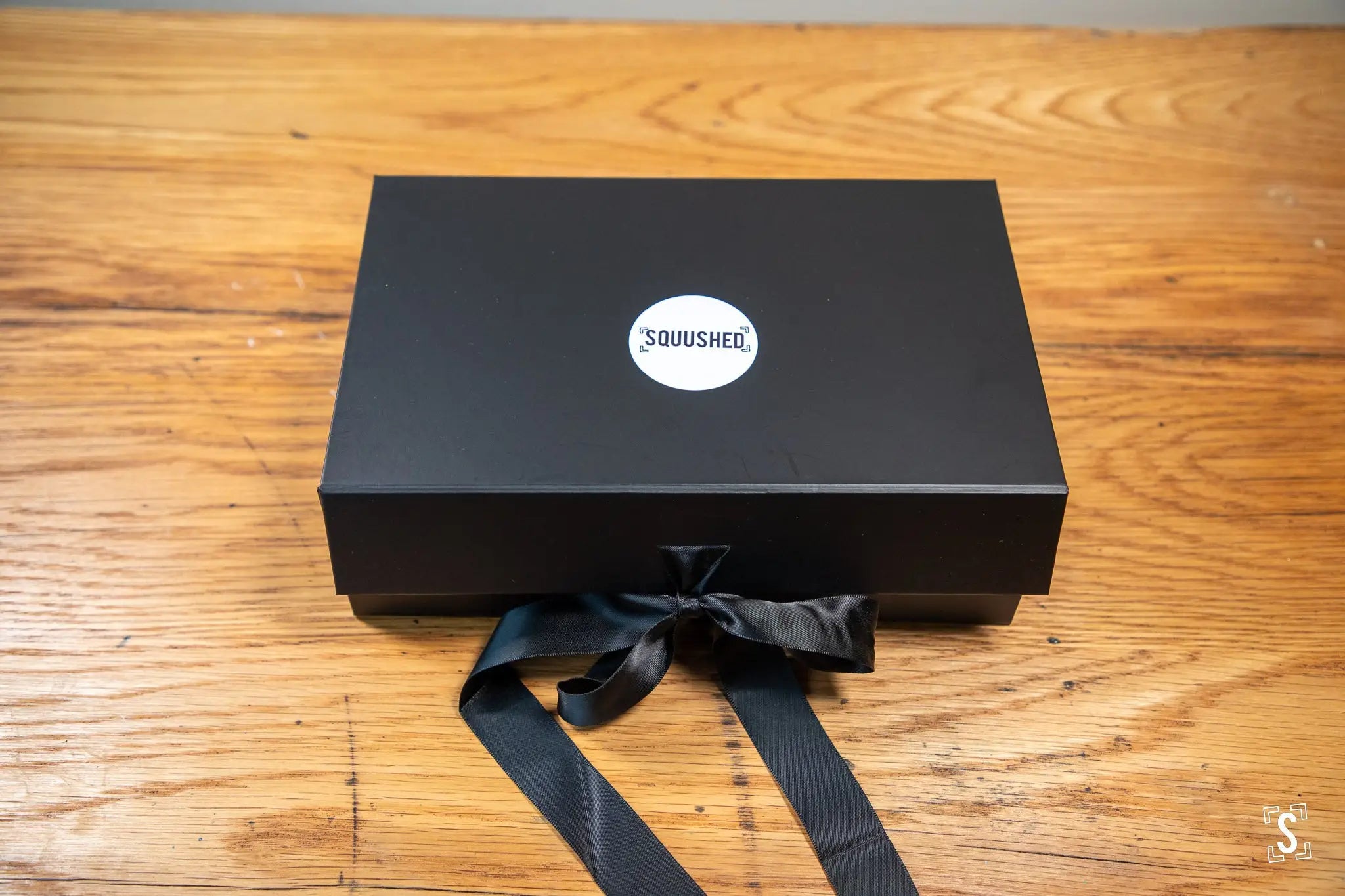 Black gift box with Squished logo and ribbon bow for Handmade Book with Japanese Chiyogami art