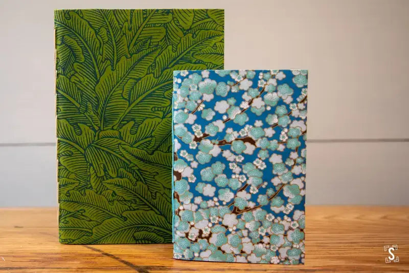 Two decorative notebooks with Japanese Chiyogami covers and chain stitch binding