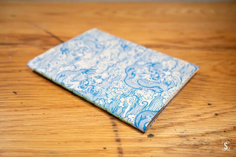 Handmade notebook with blue and white marbled cover made of Nepalese Lokta paper