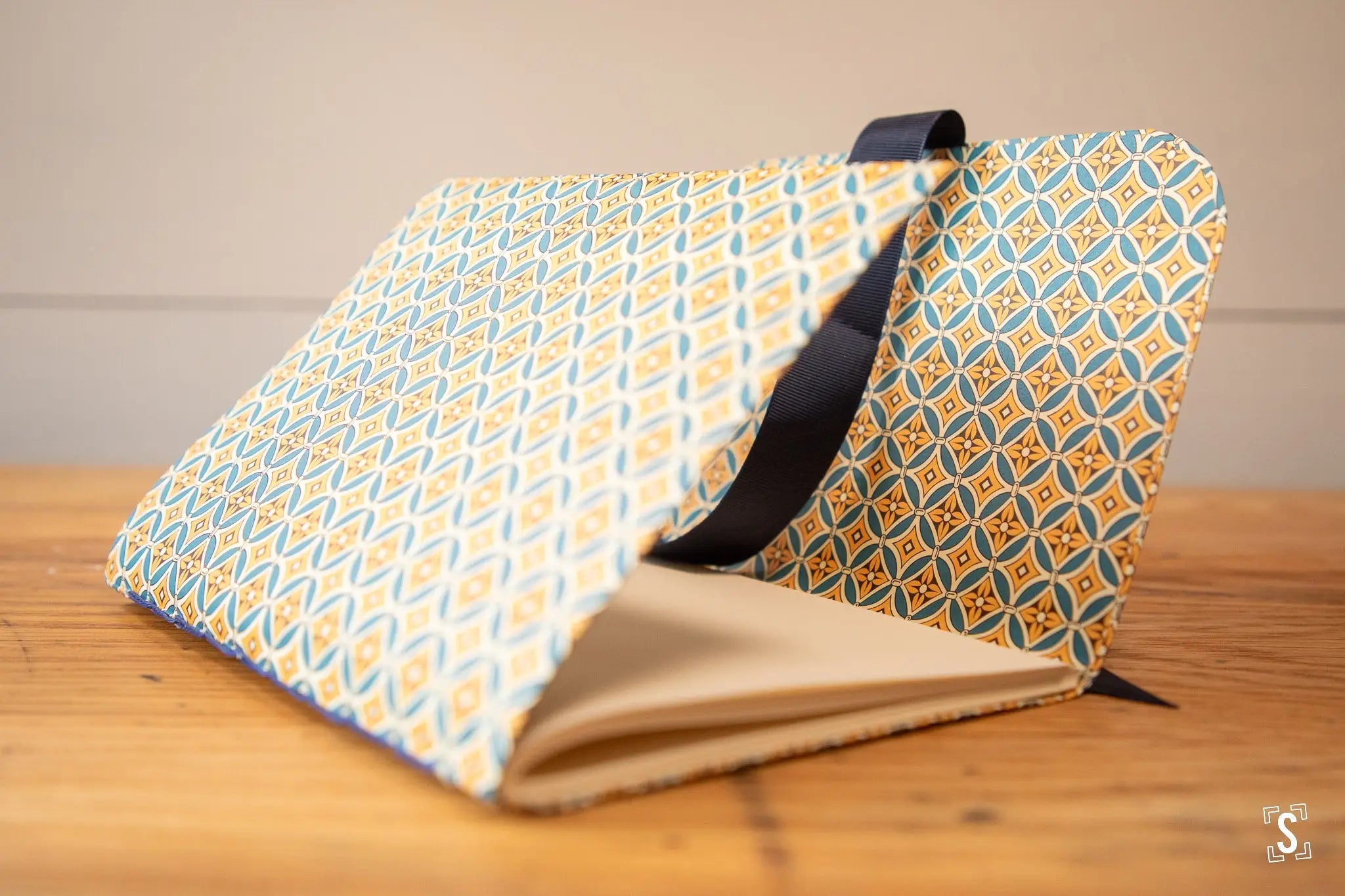 Hand designed patterned fabric notebook in blue and yellow geometric prints