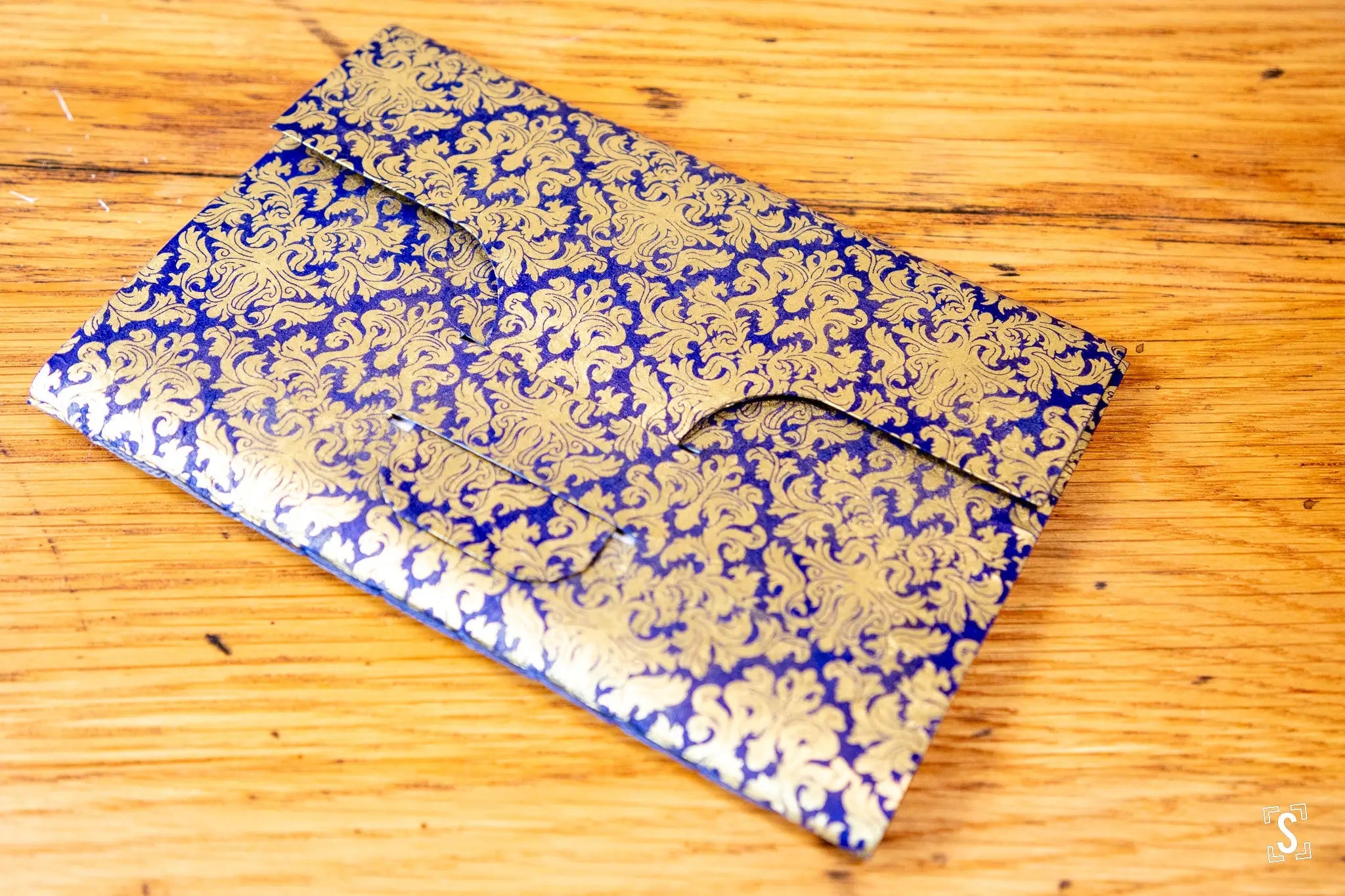 Ornate blue and gold patterned envelope art from Handmade Book with Chain Stitch closure