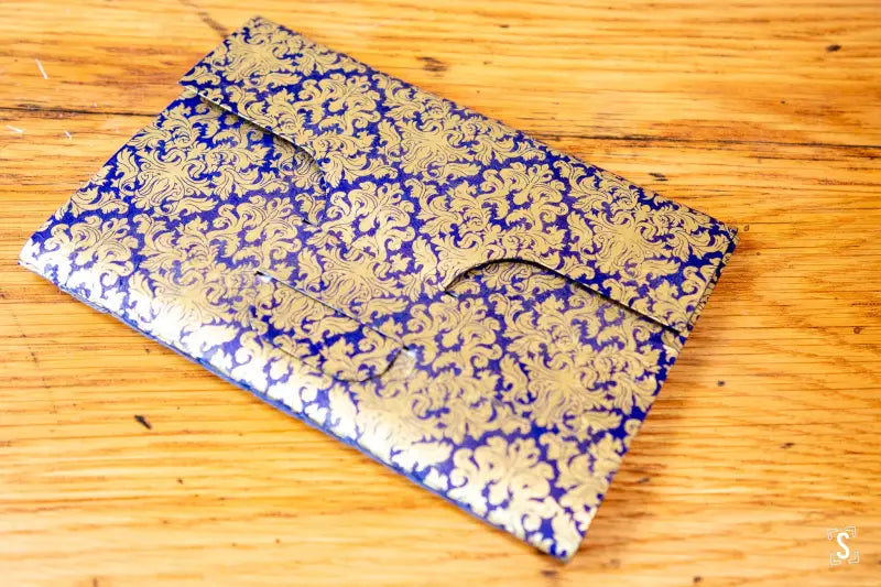 Ornate blue and gold envelope featuring Nepalese Lokta paper and integrated tab closure