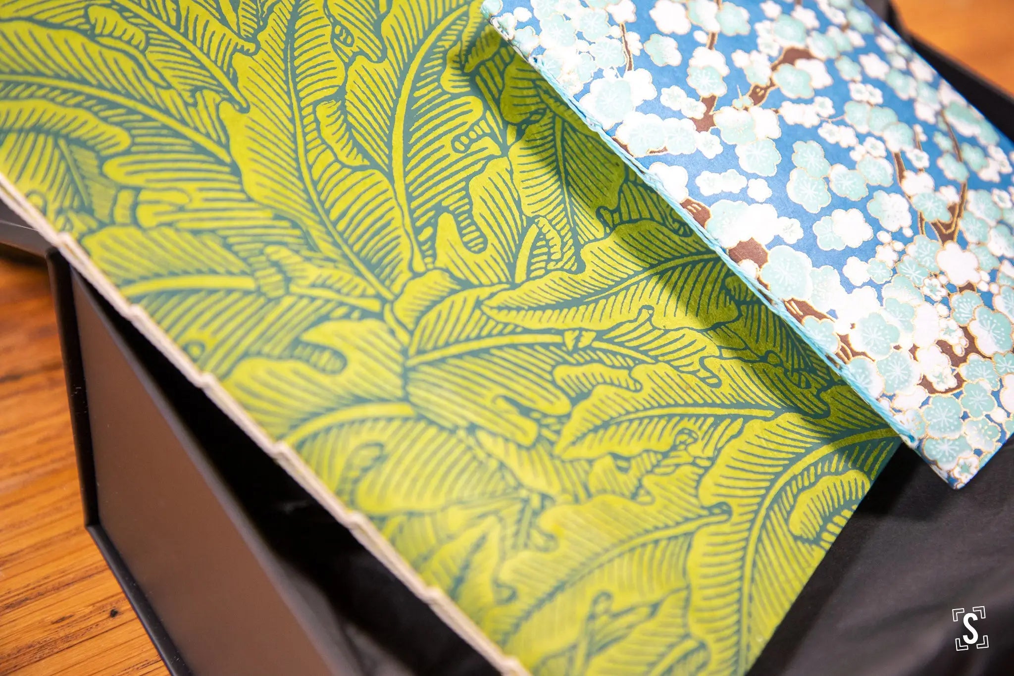 Patterned fabric featuring leaf designs in green and blue for Handmade Books art