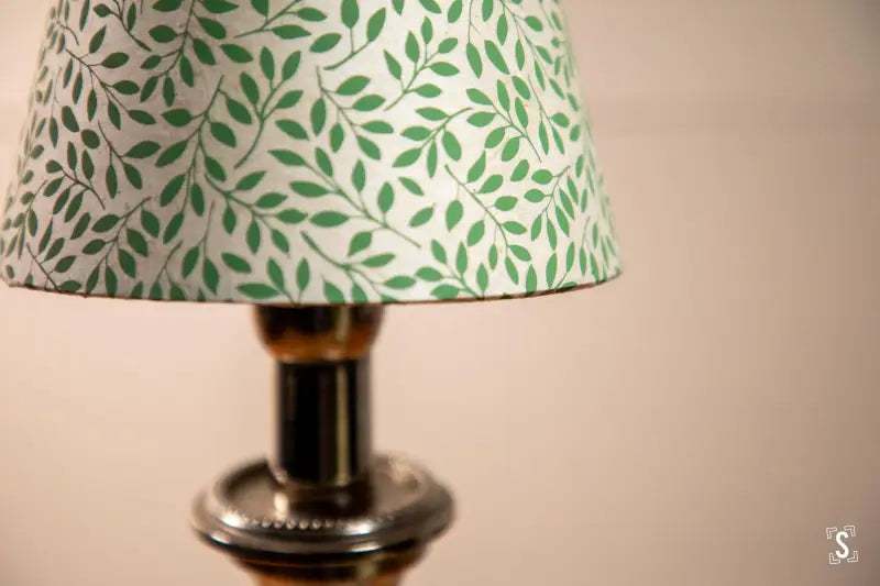 Candle lampshade featuring leafy green leaf pattern on white fabric, clips directly