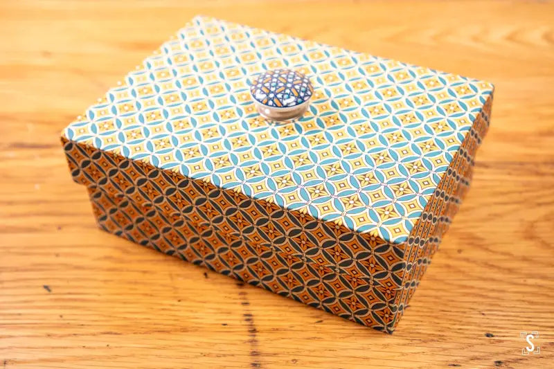 Decorative handmade keepsake box featuring Circles Grid Yellow/Teal fabric with crystal knob