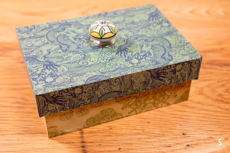 Handmade Keepsake Box featuring a decorative blue lid and floral knob design