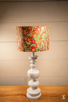 Decorative table lamp featuring a handmade lampshade with intricate patterns and chiyogami paper