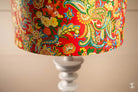 Colorful handmade lampshade featuring intricate floral and paisley patterns on white base