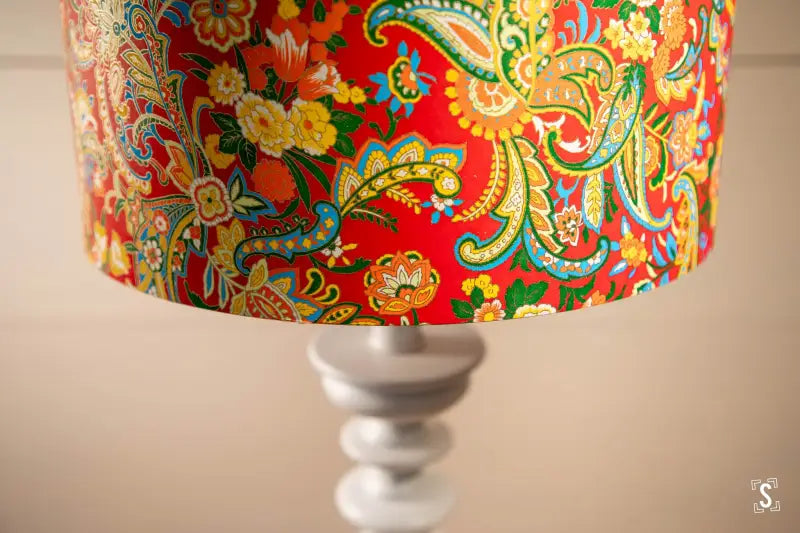 Colorful handmade lampshade featuring intricate floral and paisley patterns on white base