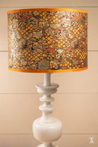 Handmade Lampshade featuring intricate patterns and a white base with gold details