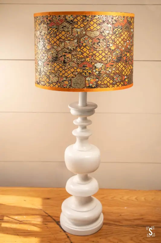 Handmade Lampshade Opium featuring chiyogami paper with intricate patterns on a table lamp