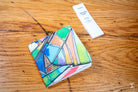 Colorful wallet with geometric patterns and stained glass design for chain stitch binding