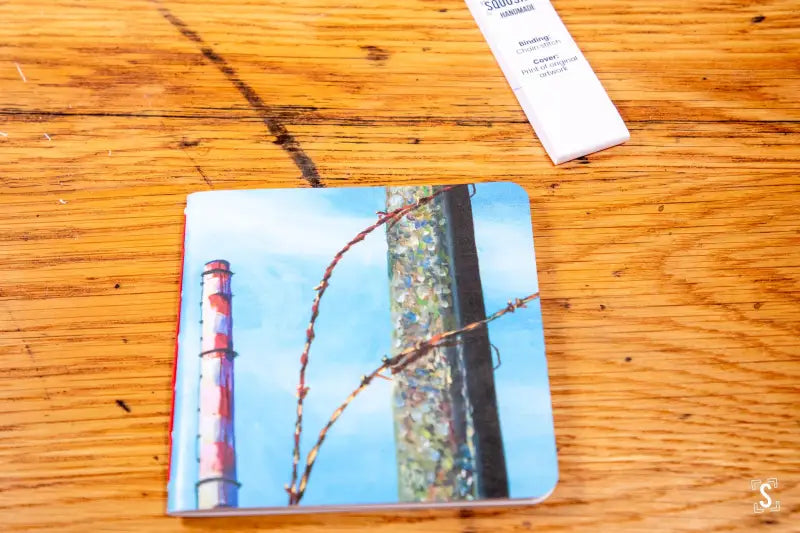 Coaster with lighthouse and bird feeder image on Handmade Notebook with Chain Stitch design