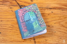 Colorful Handmade Pocket Notebook featuring an artistic door design on the cover