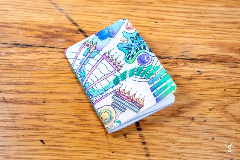 Colorfully decorated Handmade Pocket Notebook with sketches of famous landmarks