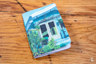 Colorful Handmade Pocket Notebook with a painted house scene on the cover