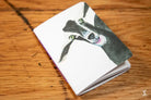 Handmade Pocket Notebook featuring a black and white dog illustration on the cover