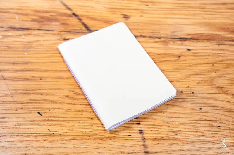 White notebook with a plain cover, perfect for a Handmade Pocket Notebook