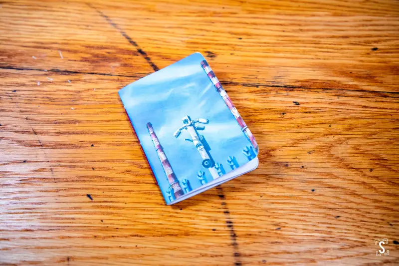 Blue unicorn design on a handmade pocket notebook with a stylish passport cover