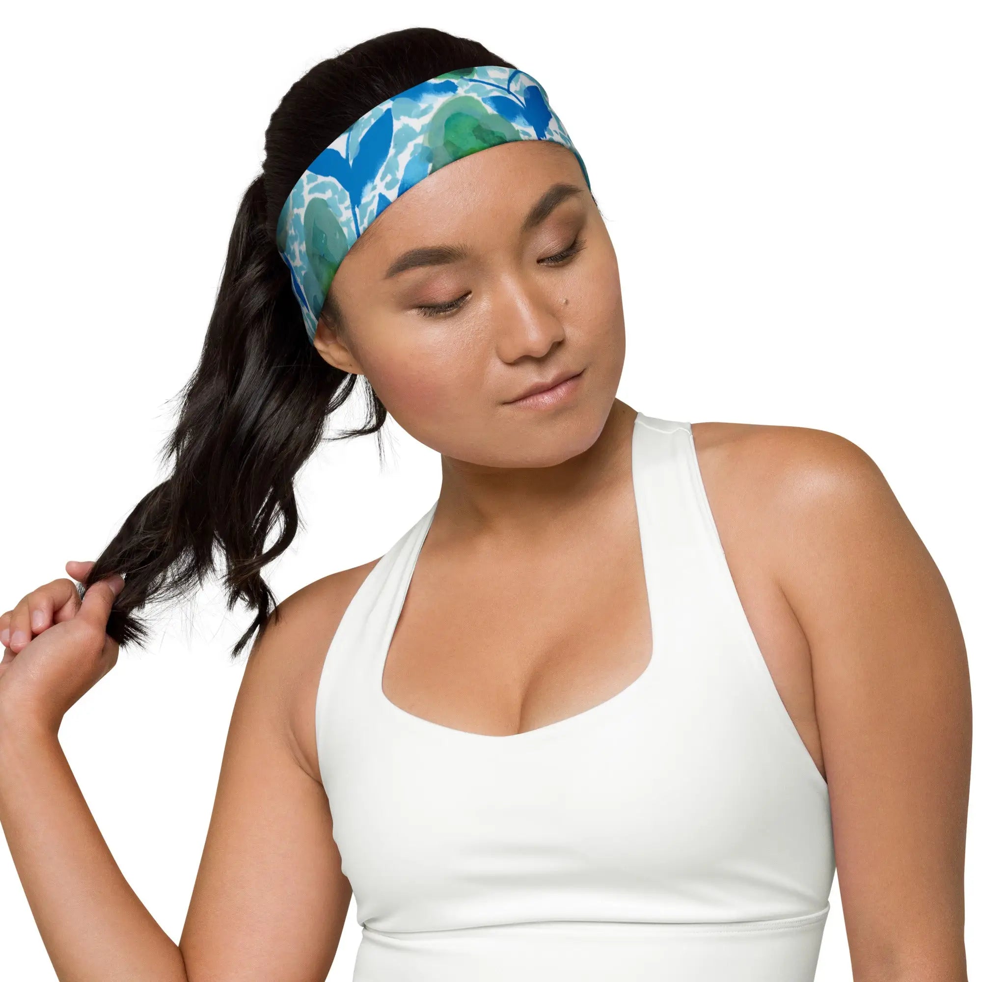Woman wearing a blue and green floral fabric headband