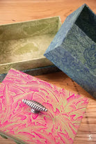 Decorative keepsake boxes with embossed floral patterns in pink, green, and blue colors