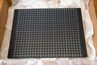 Black cutting mat with white grid lines for Kit Bookbinding Tools