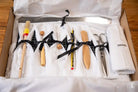 Culinary tool kit organized in fabric roll, ideal for bookbinding tools and hand designed prints