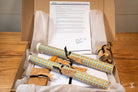 Coptic Stitch kit featuring a diploma rolled in parchment paper within a presentation box