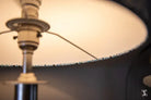 Lamp with curved shade and decorative base showcased in Lampshade Making Workshop