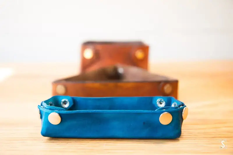 Leather trays in blue and brown with metal studs from Leathercraft Workshop products