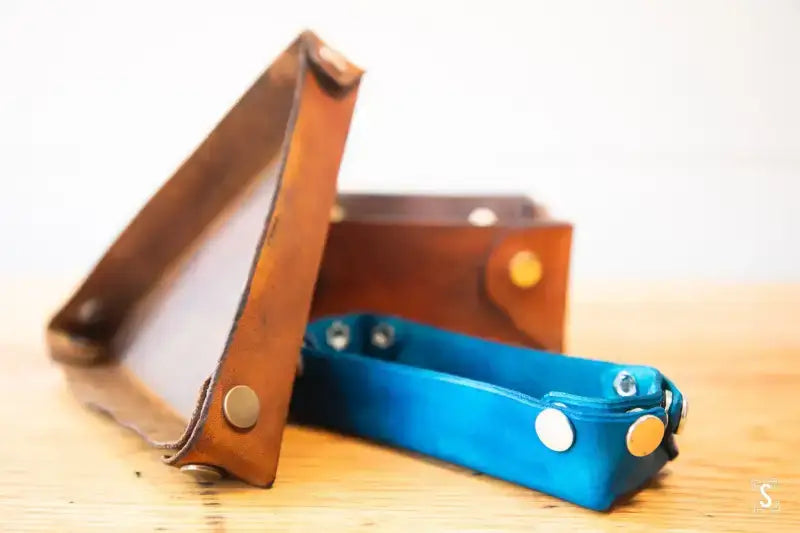 Brown and bright blue leather straps with metal rivets for No-Sew Leather Box Workshop