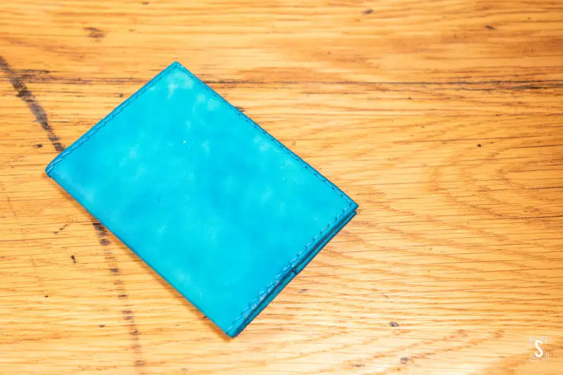 Bright turquoise leather passport holder from Leathercraft Workshop