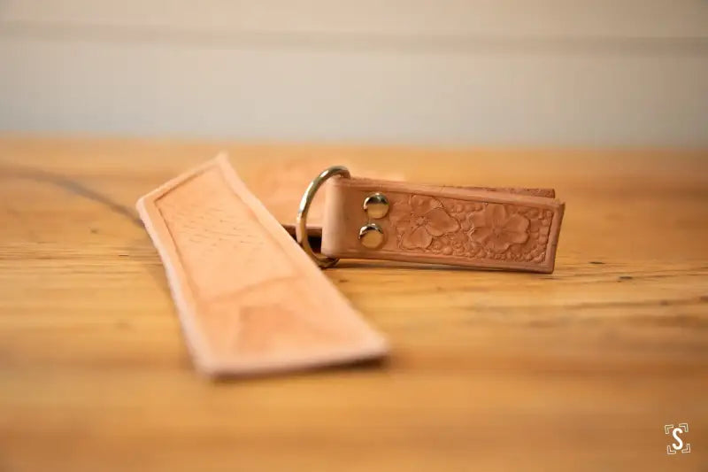 Leather belt with ornate buckle and decorative strap end from Leathercraft Workshop